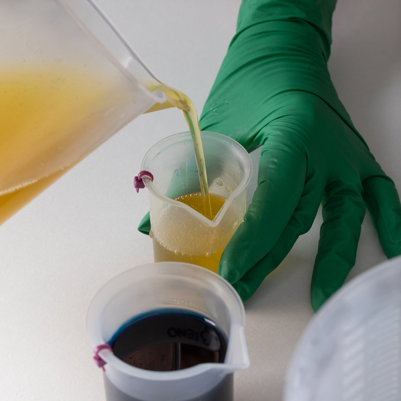 NSS worker pouring product in bespoke development process