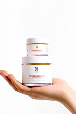Two jars of NNT Bethany balm one on top of the other