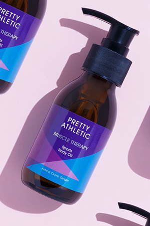 Bottle of pretty athletic's sports body oil