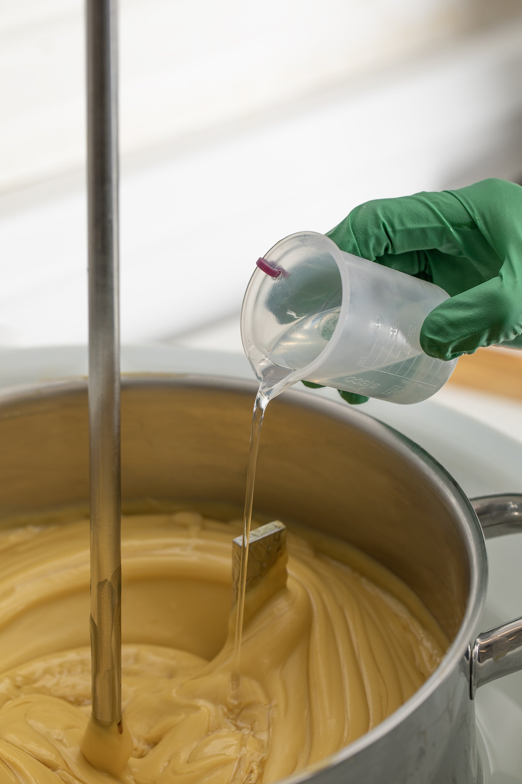 Product being poured into mixing vat
